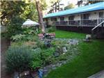 View of hotel rooms from outside at RIVERHAVEN RV PARK & MOTEL - thumbnail