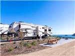 Campsite next to parked RVs at FLYING FLAGS AVILA BEACH - thumbnail