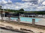 The fenced in swimming pool at KELLER'S KOVE CABIN AND RV RESORT - thumbnail