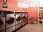 Laundry center with bookshelf at OCEAN GROVE RV RESORT - thumbnail