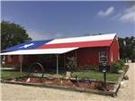 View larger image of The Texas flag painted on a roof at BIG OAK RV RESORT image #1