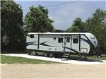 View larger image of A travel trailer in an RV site at BIG OAK RV RESORT image #11