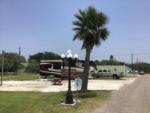 A fifth wheel trailer in a gravel RV site at ROCKPORT RV RANCH - thumbnail