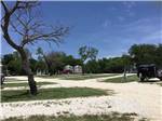 View larger image of Empty sandy campsites at OFF THE VINE RV PARK image #10