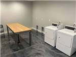 Inside of the the clean and modern laundry room at ROLLIN' HOME RV PARK - thumbnail
