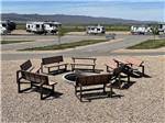 Seating around a fire pit at ROLLIN' HOME RV PARK - thumbnail