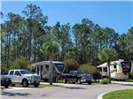 A row of back in RV sites at SUGAR SANDS RV RESORT - thumbnail
