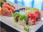 A plate of colorful sushi rolls at TRYON INTERNATIONAL RV RESORT - thumbnail