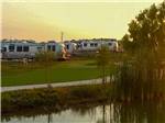 A row of trailers in RV sites at BUDA PLACE RV RESORT - thumbnail