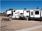 View larger image of A travel trailer in one of the gravel sites at LITTLE AMERICA RV PARK image #7