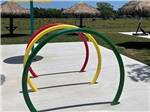 Colorful rings at the splash pad at SUGAR VALLEY RV RESORT BY RJOURNEY - thumbnail