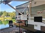 RV parked by the lake at SPLASH MAGIC RV RESORT BY RJOURNEY - thumbnail