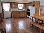 The kitchen area in one of the cabins at JAMES CREEK RV RESORT BY RJOURNEY - thumbnail
