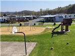 The playground next to the basketball court at JAMES CREEK RV RESORT BY RJOURNEY - thumbnail