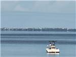 Two men in a boat in the water at PORT ST JOE RV RESORT - thumbnail
