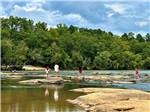 View larger image of A group of people playing in the river at BROAD RIVER CAMPGROUND image #1