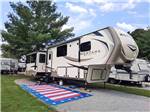 View larger image of A fifth wheel trailer in a gravel RV site at QUIET WOODS GREEN RIVER STABLES HORSE CAMP  RV PARK image #9