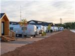 A row of Air Streams and cabins at CAMP EDDY AND LODGING - thumbnail