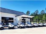 Golf carts parked in front of office at SAVANNAH LAKES RV RESORT - thumbnail