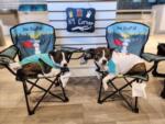 Two dogs relaxing in chairs at SAVANNAH LAKES RV RESORT - thumbnail
