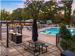 View of picnic table and pool at MAJESTIC PINES RV RESORT - thumbnail