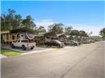 View of campsites with covers at MAJESTIC PINES RV RESORT - thumbnail