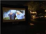Outdoor movie screen at MAJESTIC PINES RV RESORT - thumbnail