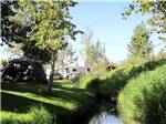 A small creek by the RV sites at FRENCH CREEK RV PARK AND CAMPGROUND - thumbnail