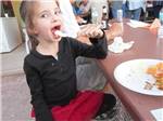 A girl eating food at a table at FRENCH CREEK RV PARK AND CAMPGROUND - thumbnail