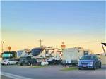 A row of trailers in paved RV sites at CENTER POINT RV PARK - thumbnail