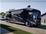 A motorhome in a paved RV site at CENTER POINT RV PARK - thumbnail
