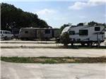 View larger image of View of campers and a vacant campsite at PHEASANT VALLEY RV PARK image #11