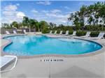 Swimming pool with folding chairs at PORT O'CONNOR RV PARK - thumbnail