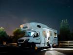 A Class C motorhome at night - thumbnail