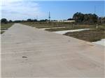 View larger image of A row of back in paved RV sites at PLEAK RV RESORT image #2