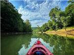 Kayak going down river, POV from paddler at PADDLE TRAIL CAMPGROUND ON THE GREEN RIVER - thumbnail