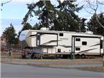 View larger image of A fifth wheel trailer in a gravel site at PACIFIC PALMS RV RESORT image #3