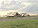Fifth wheel parked in campsite at COYOTE KEETH'S RV PARK - thumbnail