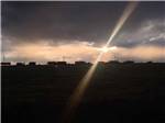 Sun shining through the clouds in the evening at COYOTE KEETH'S RV PARK - thumbnail