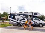 A family and a dog outside of a motorhome at LOVE'S RV STOP - 801 - thumbnail