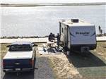 A trailer parked by the water at SUN OUTDOORS CHINCOTEAGUE BAY - thumbnail