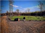 The children's playground equipment in the distance at RINGLER FAMILY CAMPGROUND - thumbnail