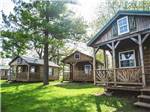 Some of the cabins with decks at MYSTIC WATERS FAMILY CAMPGROUND - thumbnail