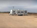 5th wheel in dirt site at Buffalo RV Park - thumbnail