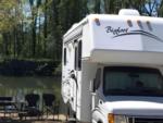 RV parked near lake at site Clear Lake Campground - thumbnail