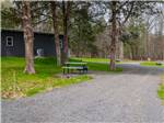 A gravel site with a picnic bench at RURAL HILL FARM - thumbnail