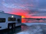 Camper during sunrise at Sleeping Buffalo Hot Springs & Resort - thumbnail