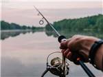 A man's hand fishing at JETSTREAM RV RESORT AT WHARTON - thumbnail