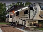 A fifth wheel parked in a site at JETSTREAM RV RESORT AT WHARTON - thumbnail