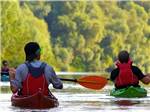 Two men kayaking in the river at JETSTREAM RV RESORT AT WHARTON - thumbnail